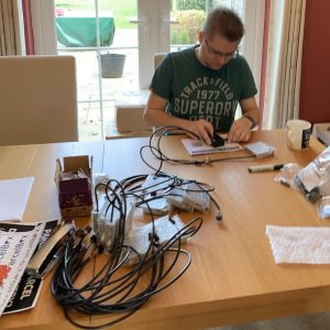 iParcelBox founder assembling the electronic components for the first trial smart parcel delivery box units ready to send to customers