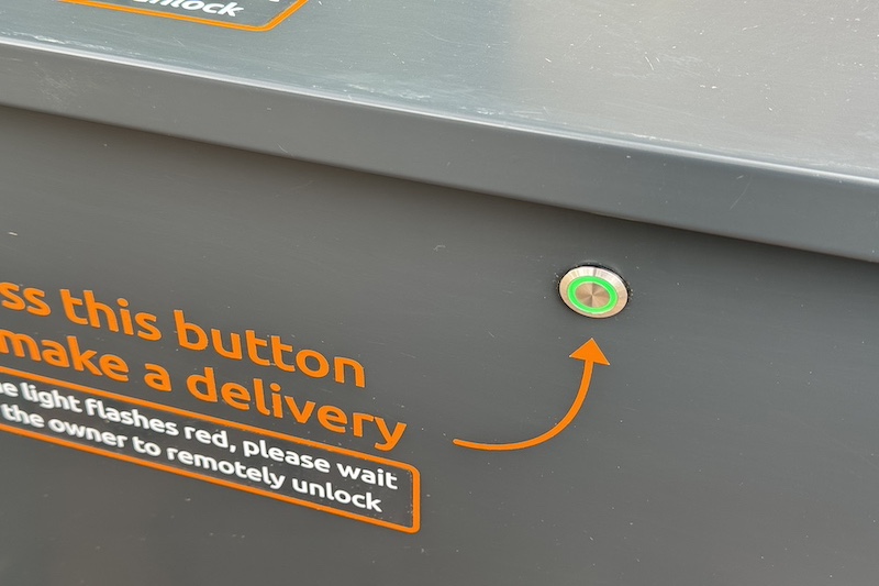 Image showing iParcelBox smart parcel delivery box button with a green light, indicating that it is unlocked ready to accept a delivery.